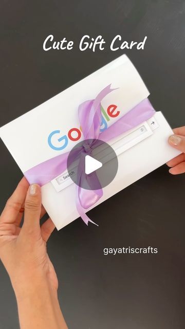 someone is opening up a google gift card