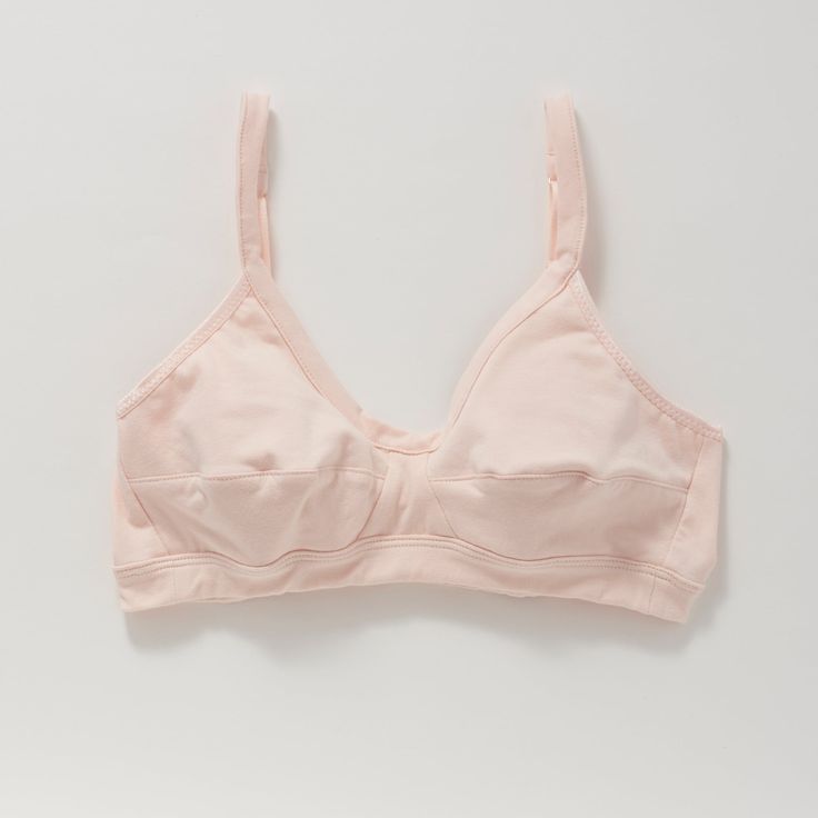 A more supportive style for larger cup sizes. Horizontal seams across the cups, fabric front straps and other thoughtful details shape and support—without sacrificing style or comfort. Designed with measurements from real women, not mannequins. Supports A-D cups. Slip-on style, no back closure. Adjustable straps with rose gold hardware. Double-layered, organic cotton with a covered elastic band. 94% organic cotton, 6% spandex. Cut and sewn in the U.S. Machine wash and dry. Size Guide Fitted Full Coverage Sports Bra With Built-in Cups, Supportive Full Coverage Bra With Built-in Cups, Supportive Nursing Bra For Everyday Use, Everyday Fitted Seamless Nursing Bra, Everyday Nursing Bra With Removable Pads, Stretch Nursing Bra For Everyday, Everyday Fitted Bra With Medium Bust Support, Fitted Nursing Bra For Everyday, Everyday Fitted Nursing Bra