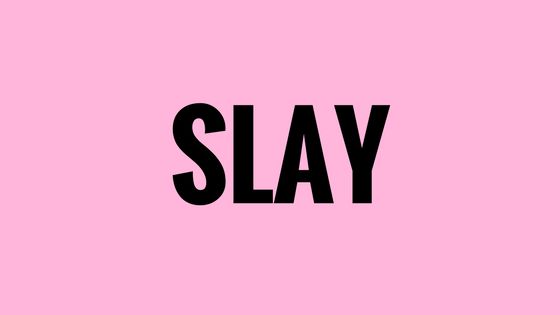 the word slay is shown in black on a pink background with an arrow pointing to it