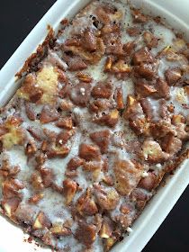 a casserole dish with meat and cheese in it on a black counter top