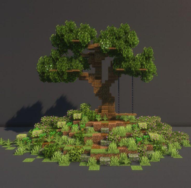 an image of a tree that is in the middle of some grass and dirt area