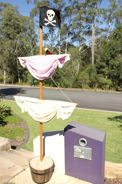 a pirate flag on top of a mailbox