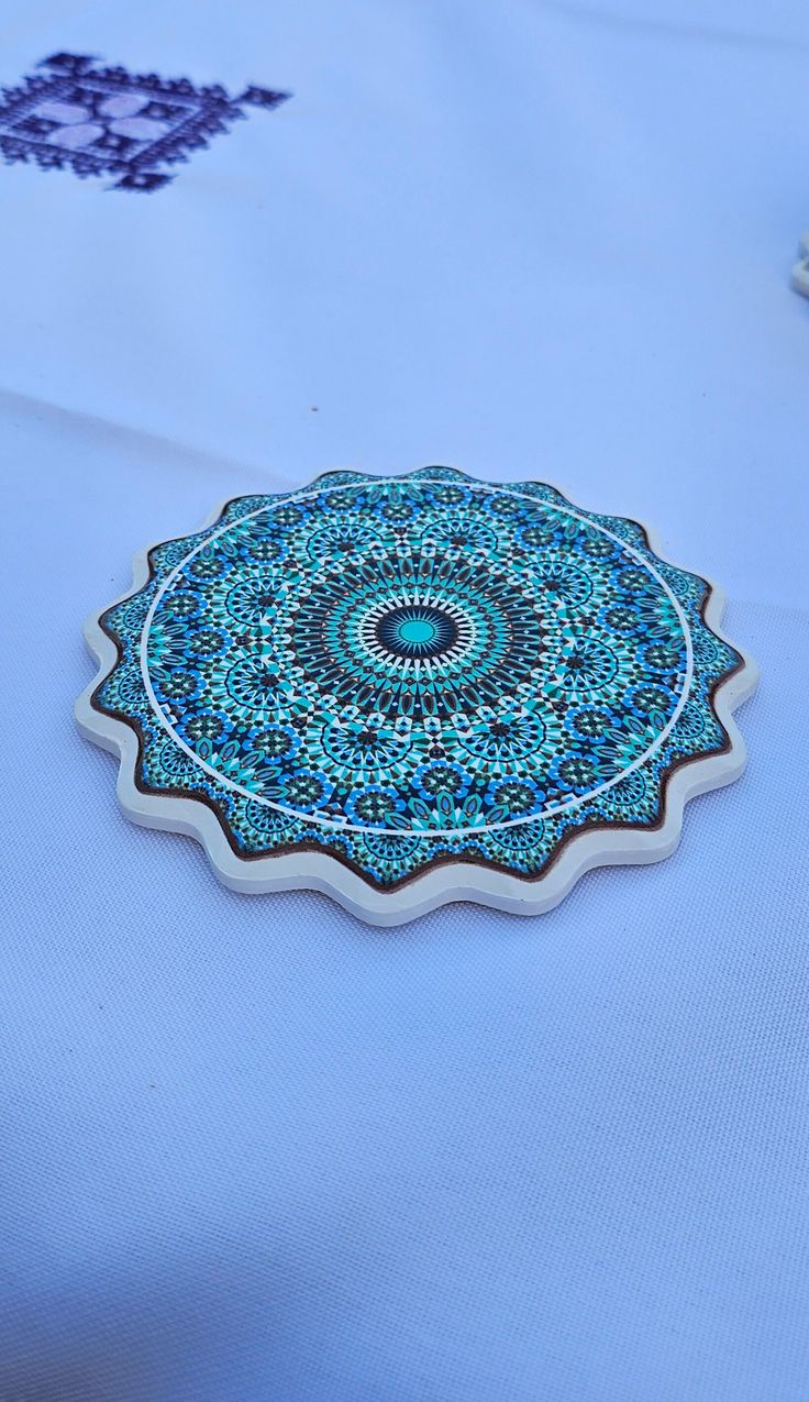 a blue table cloth with an intricate design on it