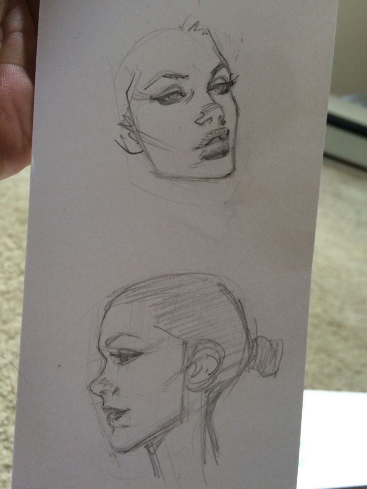 three different types of head sketches on paper