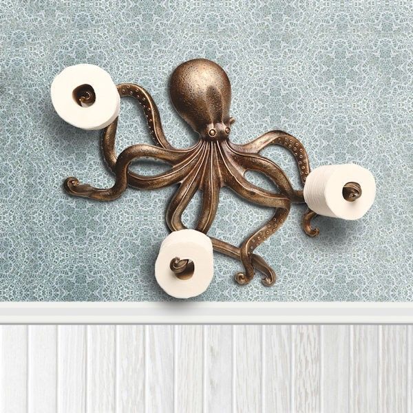 an octopus toilet paper holder with two rolls of toilet paper on it's side