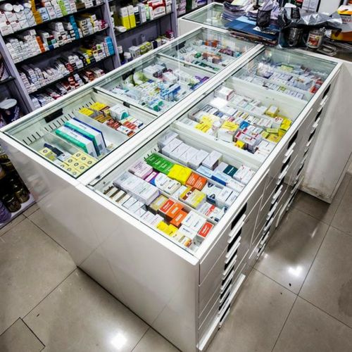 a store display case filled with lots of different types of medicine bottles and containers on top of each shelf