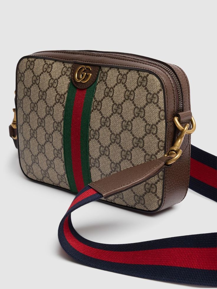 Height: 16cm Width: 23.5cm Depth: 4.5cm. Weight: 680g. Strap drop: 57cm. Adjustable strap. Top zip closure. Logo details. All over pattern placement may vary. Leather trim. Lined Gucci Ophidia, Sports Sweatshirts, Crossbody Messenger Bag, Work Bags, Strap Top, Sports Brands, Sports Accessories, Toiletry Bags, Swim Accessories