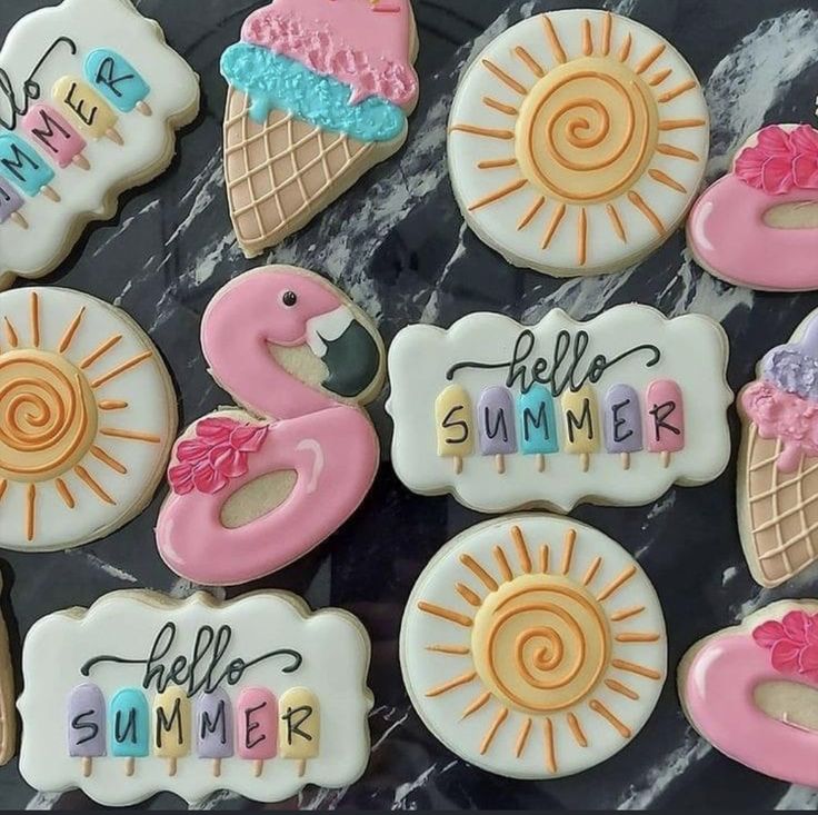 decorated cookies with the words hello summer and flamingos on them are arranged in rows