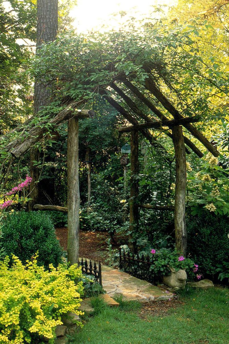 a garden with lots of trees and flowers