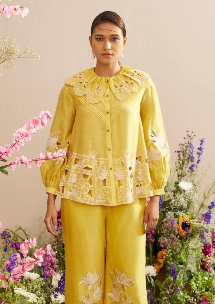 Editor's Note Featuring a yellow chanderi contrast applique and cutwork shirt Note: Pant worn by model is for styling purposes and can be purchased separately. Color: Yellow Fabric: Chanderi Co... Resham Embroidery Tops For Summer Designer Wear, Summer Designer Wear Tops With Resham Embroidery, Summer Designer Tops With Resham Embroidery, Yellow Cutdana Sets For Spring, Spring Cotton Sets With Embroidered Sleeves, Designer Sets With Resham Embroidery For Spring, Designer Long Sleeve Sets For Spring, Spring Cutdana Set With Long Sleeves, Spring Long Sleeve Cutdana Sets