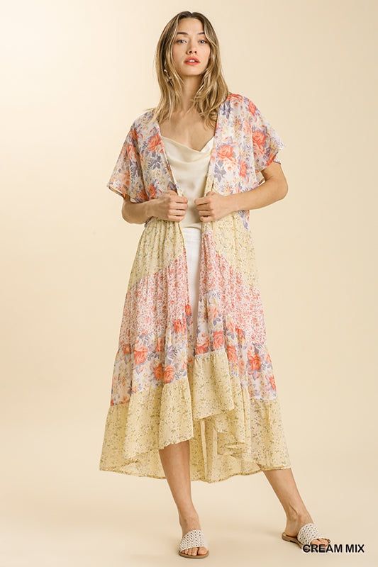 UmgeeSheer mixed floral print tiered open front long kimono. A lightweight and breezy kimono that's perfect for showcasing your favorite summer looks and adding texture and color to your wardrobe.Color: Cream MixSizes: S-M-LOur model is 5' 8" wearing a small 100% Polyester, importedC5/A0266 Summer Floral Print Kimono For Brunch, Summer Short Sleeve Kimono For Spring, Spring V-neck Kimono Beach Cover-up, Spring V-neck Kimono For Beach Cover-up, Multicolor Spring Kimono For Brunch, Spring Multicolor Kimono For Brunch, Spring Brunch Multicolor Kimono, White Boho Print Kimono For Spring, Summer Kimono With Floral Print For Brunch