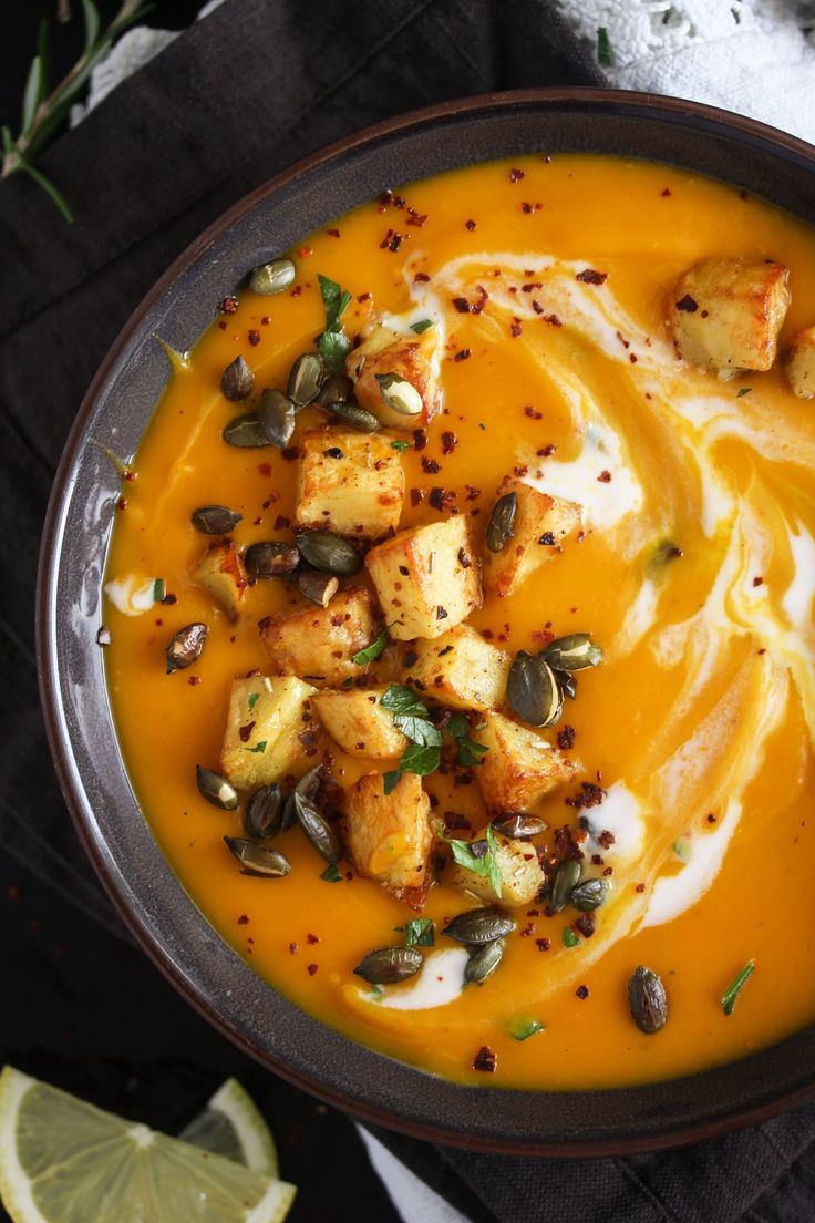 a bowl filled with soup and topped with croutons