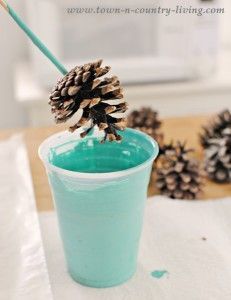 a pine cone is sticking out of a cup