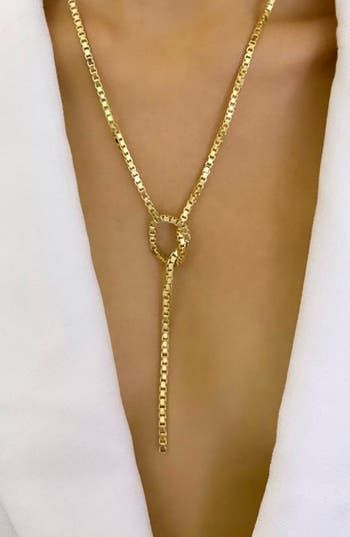 Just the right accent for any look, this sterling-silver lariat necklace plated in 18-karat gold boasts an adjustable length and a versatile box-chain design. 20" length; 3" drop Sterling silver/18k-gold plate Imported Latinx Owned/Founded Elegant Link Chain Lariat Necklace, Elegant Lariat Necklace With Link Chain, Elegant Lariat Link Necklace, Fine Jewelry Lariat Necklace With Adjustable Chain, Formal Lariat Chain Necklace In Fine Jewelry Style, Elegant Yellow Gold Lariat Necklace With Box Chain, Formal Fine Jewelry Lariat Chain Necklace, Formal Lariat Chain Necklace Fine Jewelry, Modern Adjustable Yellow Gold Chain Necklace