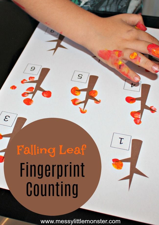 a child's hand on top of a fingerprint counting game with the words falling leaf