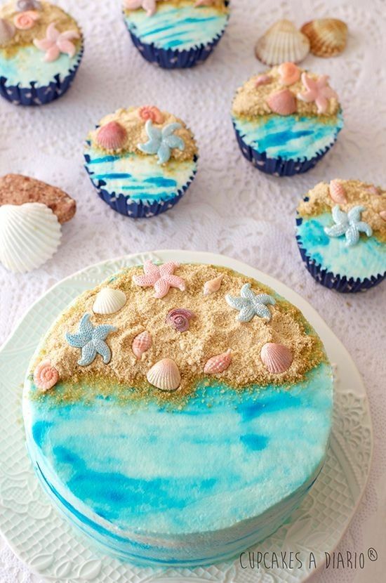 there are cupcakes that have been decorated with sand and seashells