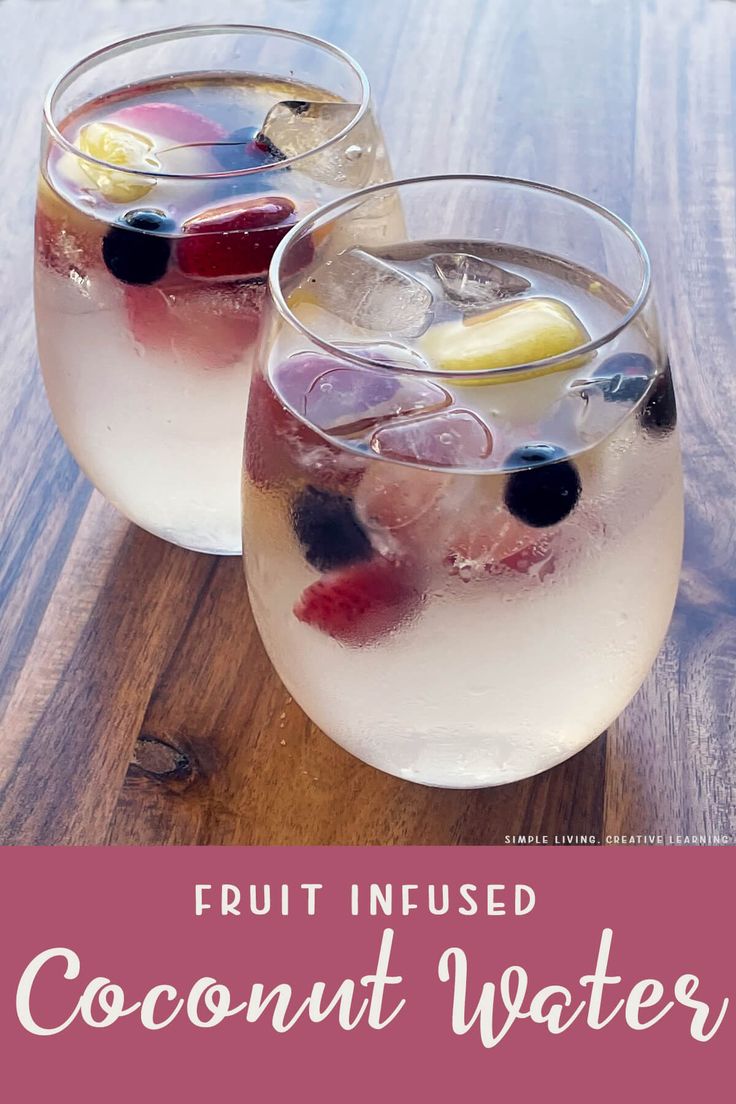 two glasses filled with fruit infused coconut water