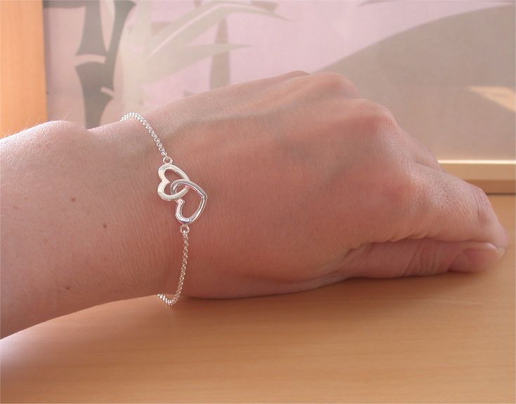 Very pretty, sterling silver linked heart, chain bracelet. The bracelet measures 7.5 inches in length (19cm) maximum. This bracelet can be adjusted to suit a smaller wrist and reduce down to 6.5 inches. A sturdy, sterling silver lobster clasp is attached. The bracelet is stamped 925.   This bracelet will be gift wrapped in acid free tissue paper and pretty organzo gift bag.  UK delivery can take between 1-2 working days.   U.SA & Europe delivery can take 10-28 working days for delivery. Silver Heart Jewelry, Sterling Silver Heart Bracelet, Heart Jewellery, Birthstone Gems, Silver Heart Bracelet, Bracelet Heart, Jewelry Heart, Jewellery Uk, Bridal Bracelet