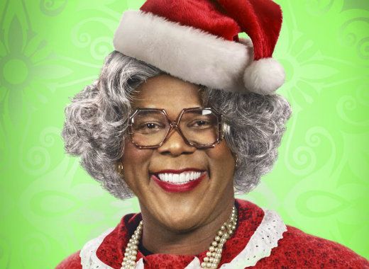 an older woman wearing a santa hat and glasses