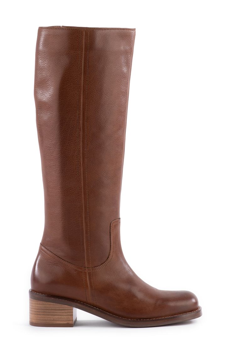 A low stacked heel gives just-right height to a classic leather boot with Western-inspired stitching at the vamp. Inset side-zip closure Leather upper/synthetic lining and sole Imported