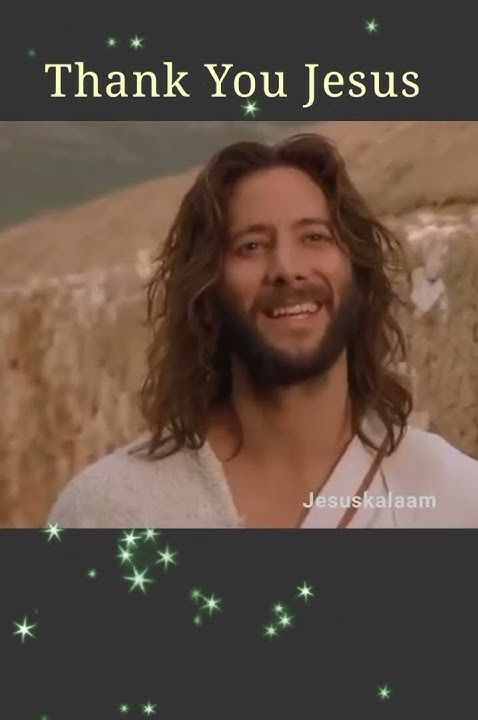 a man with long hair and a beard smiles in front of a star filled sky