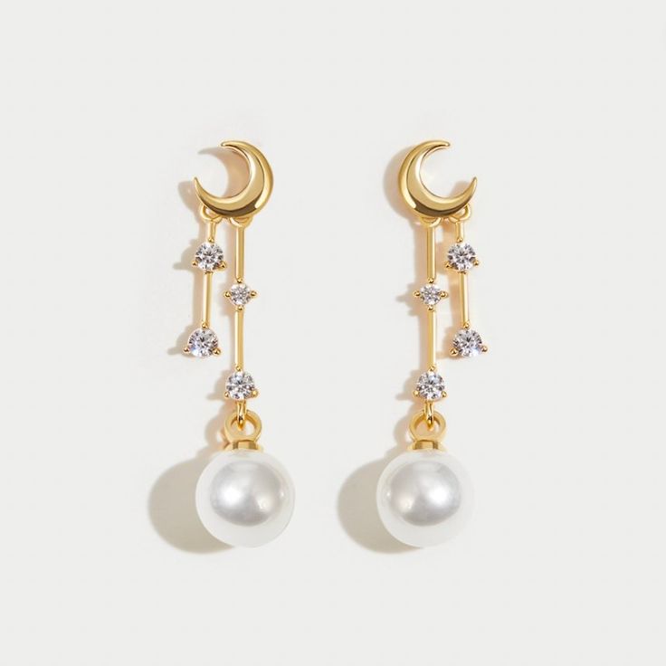 The moon glows softly every night in the sky. It serves as a reminder that no matter how dark it may appear to be, hope & light can be found anywhere. Keep these beautiful earrings close to chase your dreams and follow your heart always. 18K gold plated Imitation pearl, crystal Size: 1.1in x 0.2in Pushback stud closure Hypoallergenic, lead & nickel free If you aren't in LOVE with your purchase, please let us know within 30 days of receiving your item, and you'll receive a stress-free refund. Elegant Moon Shaped Earrings With Sun And Moon Design, Elegant Sun And Moon Design Drop Earrings, Celestial Moon Phase Moon Earrings, Elegant Hypoallergenic Moon Shaped Earrings, Elegant Moon-shaped Earrings For Gift, Elegant White Moon Phase Earrings, Hope Light, Pearl Crystal, Chase Your Dreams