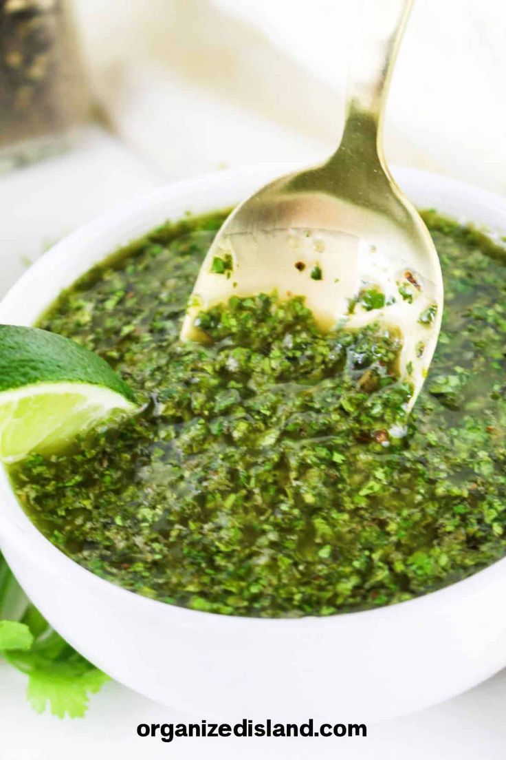 a white bowl filled with green salsa and a spoon