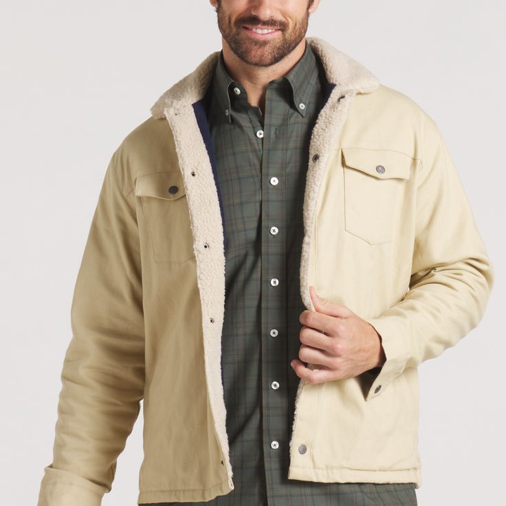 Reminiscent of the Wild West and simpler times, the Daggett County Washed Twill Jacket features a snap button closure and angled pockets to keep your hands warm during the fall and winter months. This classic jacket is perfectly designed to layer with our long sleeve pocket tees and classic stretch chino pants for a rugged look that doesn't sacrifice comfort. 100% Cotton Washed Twill 100% Polyester Fleece Liner Snap Button Closure Angled Side Pockets Model Pictured is Wearing Medium Collared Outdoor Outerwear With Buttoned Pockets, Winter Cotton Shacket With Button Closure, Beige Cotton Outerwear For Cold Weather, Everyday Cotton Outerwear With Fleece Lining, Collared Outdoor Outerwear With Buttons, Winter Outdoor Outerwear With Buttoned Pockets, Winter Cotton Outerwear With Button Closure, Fall Outdoor Outerwear With Buttoned Pockets, Single Breasted Cotton Winter Outerwear