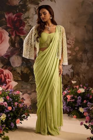 Sage green pre-draped saree with corset padded blouse. Comes with sequin, cutdana embellished cape. - Aza Fashions Green Draped Dupatta For Wedding, Green Draped Saree With Unstitched Blouse, Designer Wear Green Draped Dupatta, Green Draped Designer Wear Dupatta, Designer Green Draped Dupatta, Green Draped Sets With Dupatta, Green Georgette Draped Saree, Green Draped Georgette Dress, Fitted Pre-draped Saree In Pista Green