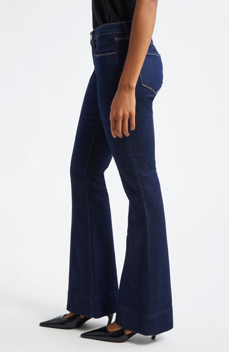 Seams down the front create an elongating effect in these dark-washed jeans flaunting a low waist and full-length, flared legs. 31" inseam; 22" leg opening; 8 1/2" front rise; 13" back rise (size 29) Zip fly with button closure Five-pocket style 94% cotton, 5% polyester, 1% spandex Dry clean Made in the USA Dark Wash Flares With Five Pockets For Fall, Dark Wash Flared Hem Flares For Fall, Fall Dark Wash Flared Hem Flares, Classic Dark Wash Flare Jeans With Standard Cut, Fitted Dark Wash Full-length Flares, Dark Wash Fitted Full-length Flares, Fitted Dark Wash Full Length Flares, Dark Wash Fitted Full Length Flares, Mid-rise Dark Wash Flares With Five Pockets