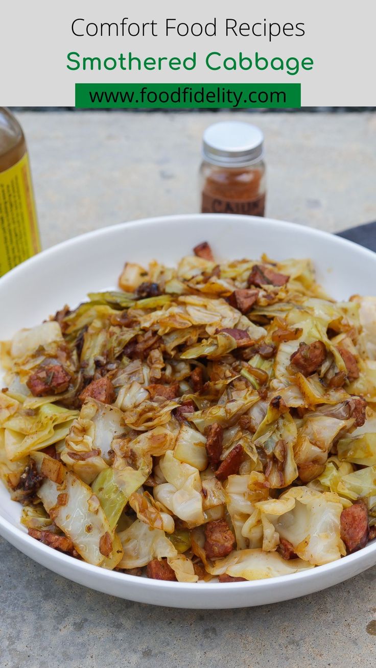 a white bowl filled with cabbage and meat next to a bottle of condiments