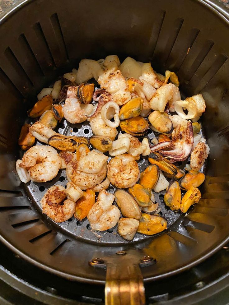 the food is being cooked in the pot on the stove