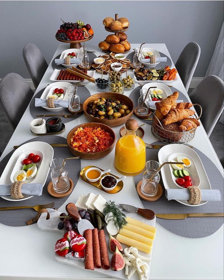 a table filled with lots of food and drinks