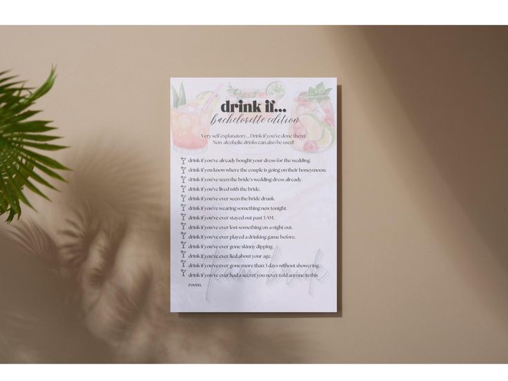 a table with a potted plant next to it and a menu on the wall