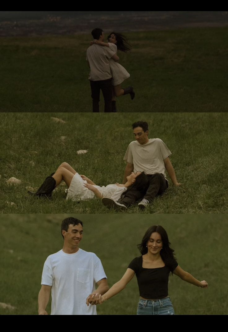 two people sitting in the grass with one holding the other's hand and another standing behind them