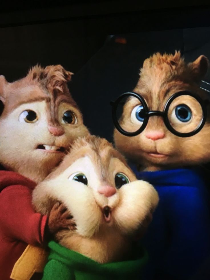 the three chipmuns are wearing glasses and one is holding his arm around the other