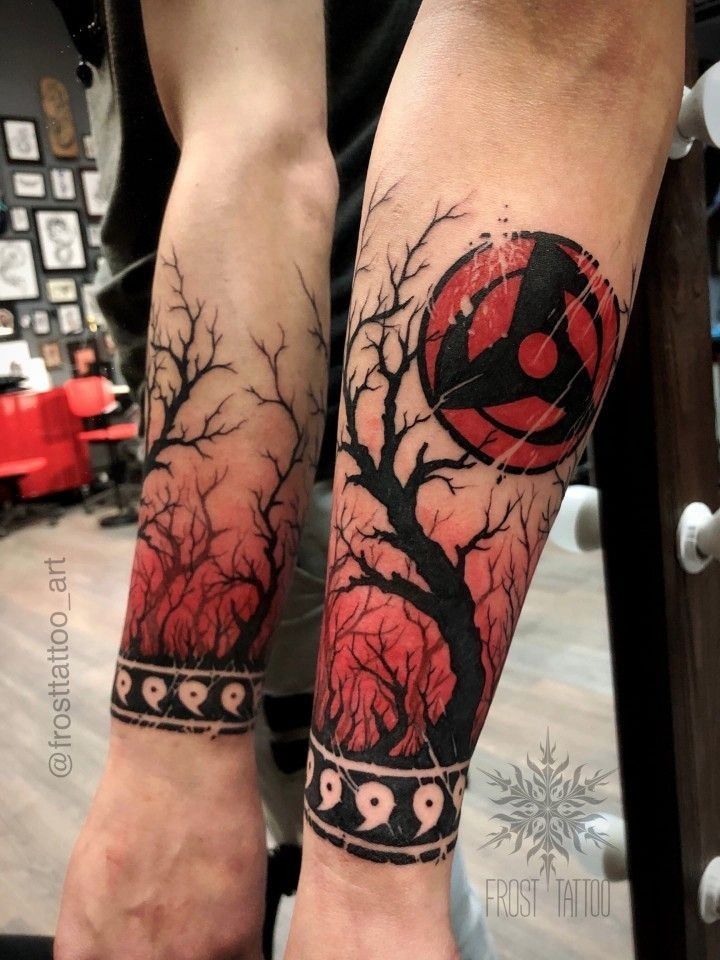 two people with tattoos on their legs and one has a red ball in the middle