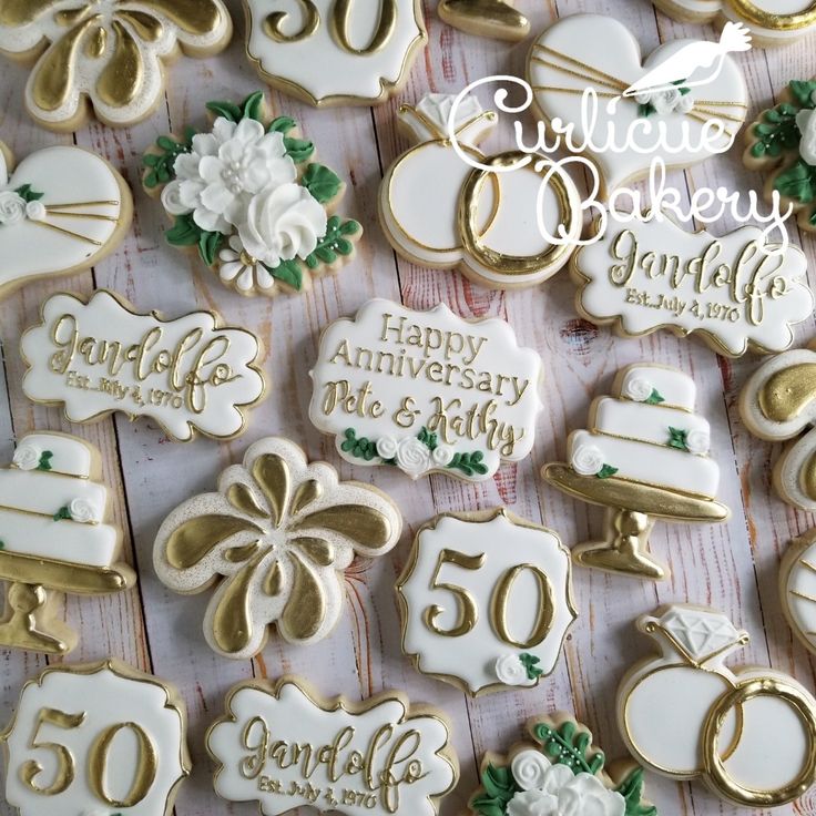 decorated cookies are displayed on a table for 50th birthday party guests to share with each other