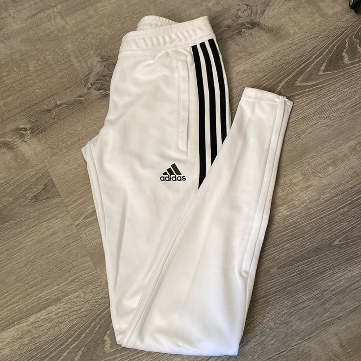 New, Never Worn, No Tags. Adjustable Drawstring At Waist, Zipper Pockets And Zipper At Ankle White Sweatpants With Three Stripes For Sports, White Adidas Sports Pants, Adidas White Sporty Sweatpants, Sporty White Bottoms With Side Stripes, White Stretch Bottoms With Three Stripes, Fitted White Bottoms With Side Stripes, Sporty Fitted White Pants, Sporty White Fitted Pants, White Adidas Bottoms With Three Stripes