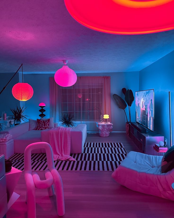 a living room with pink and blue lighting