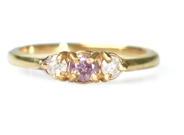 three stone ring in yellow gold with pink and white diamonds