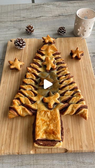 a christmas tree made out of pastry on a cutting board