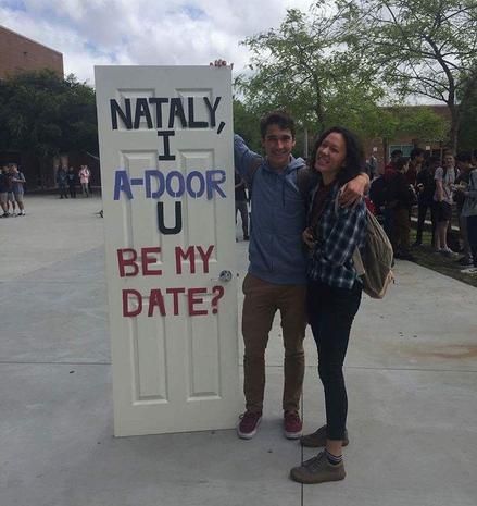 two people standing in front of a door that says nattaly i adoor be my date?