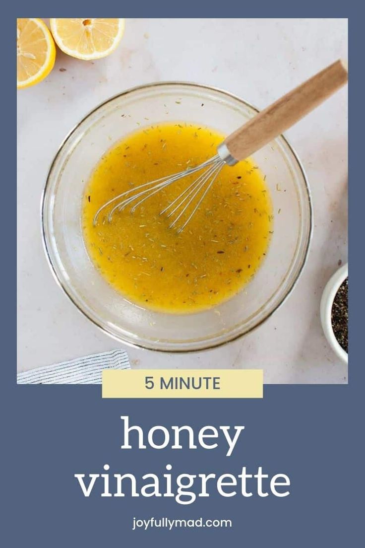 the ingredients for honey vinaigrette in a glass bowl