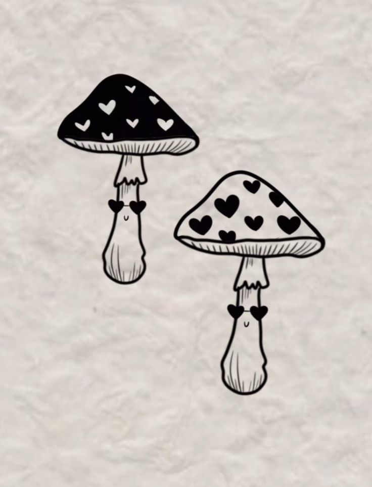 two mushrooms with hearts painted on them