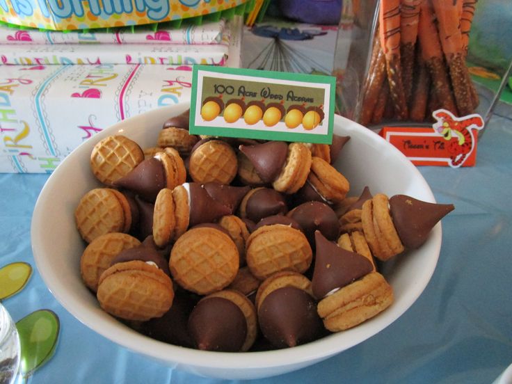 a bowl filled with chocolate covered waffles on top of a blue table cloth