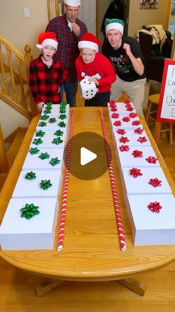 a group of people standing around a table with candy canes