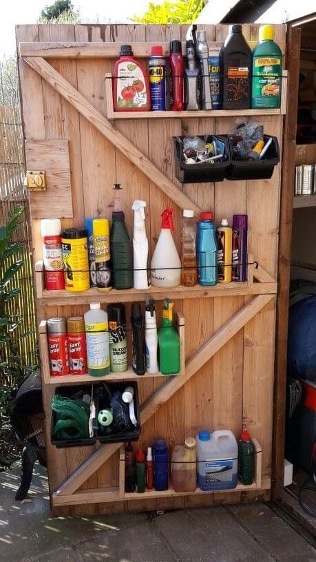 a wooden shelf filled with lots of cleaning products