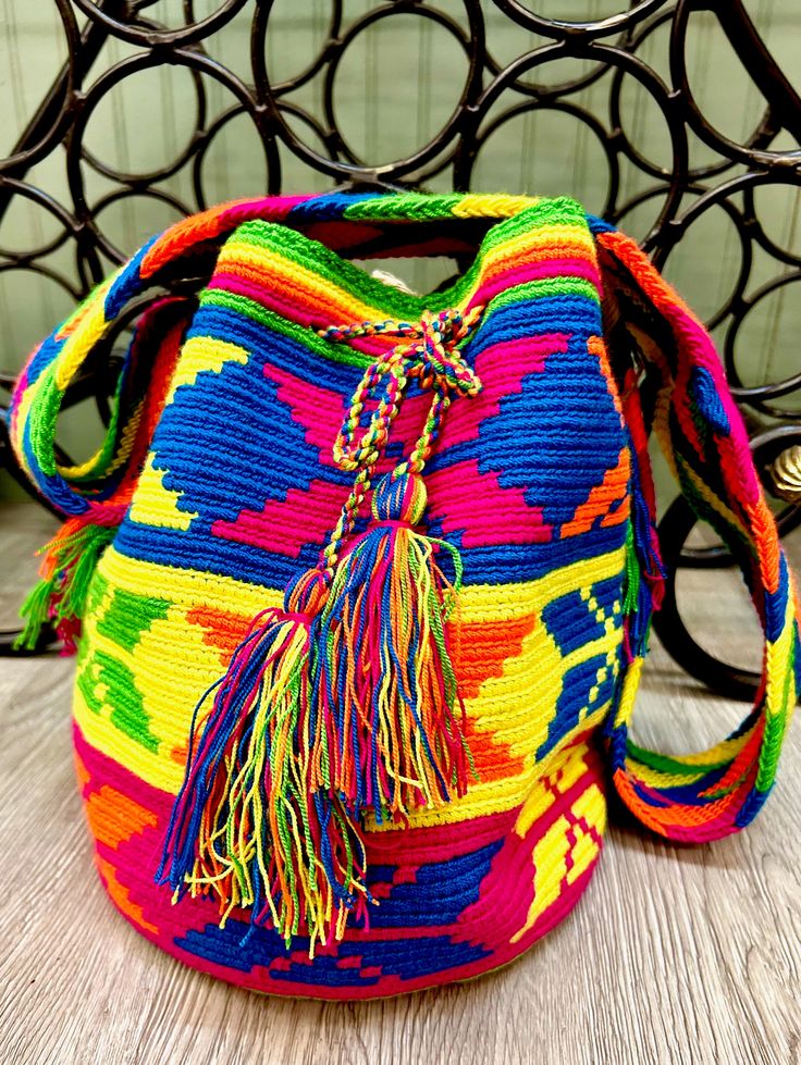 "These beautifully handcrafted crossbody bags are handwoven by Columbian Artisans, each with unique and exclusive designs, with bright colors or tan/brown color scheme. Each bag is approximately 11\" wide x 12\" high with strap size approximately 36\" long (each bag may vary by 1 inch or so)." Brown Color Scheme, Goddess Of The Sea, Brown Color Schemes, Blue Moon, Handmade Bags, Sling Bag, Tan Brown, Crossbody Shoulder Bag, Crochet Bag