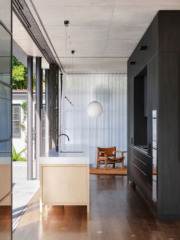 the kitchen is clean and ready to be used as a living room or dining area